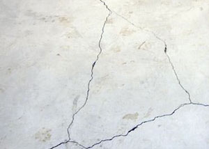 cracks in a slab floor consistent with slab heave in Chalmette.