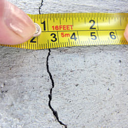 A crack in a poured concrete wall that's showing a normal crack during curing in Luling
